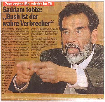 2004-07-02-saddam-vor-gericht-express-seite2.jpg